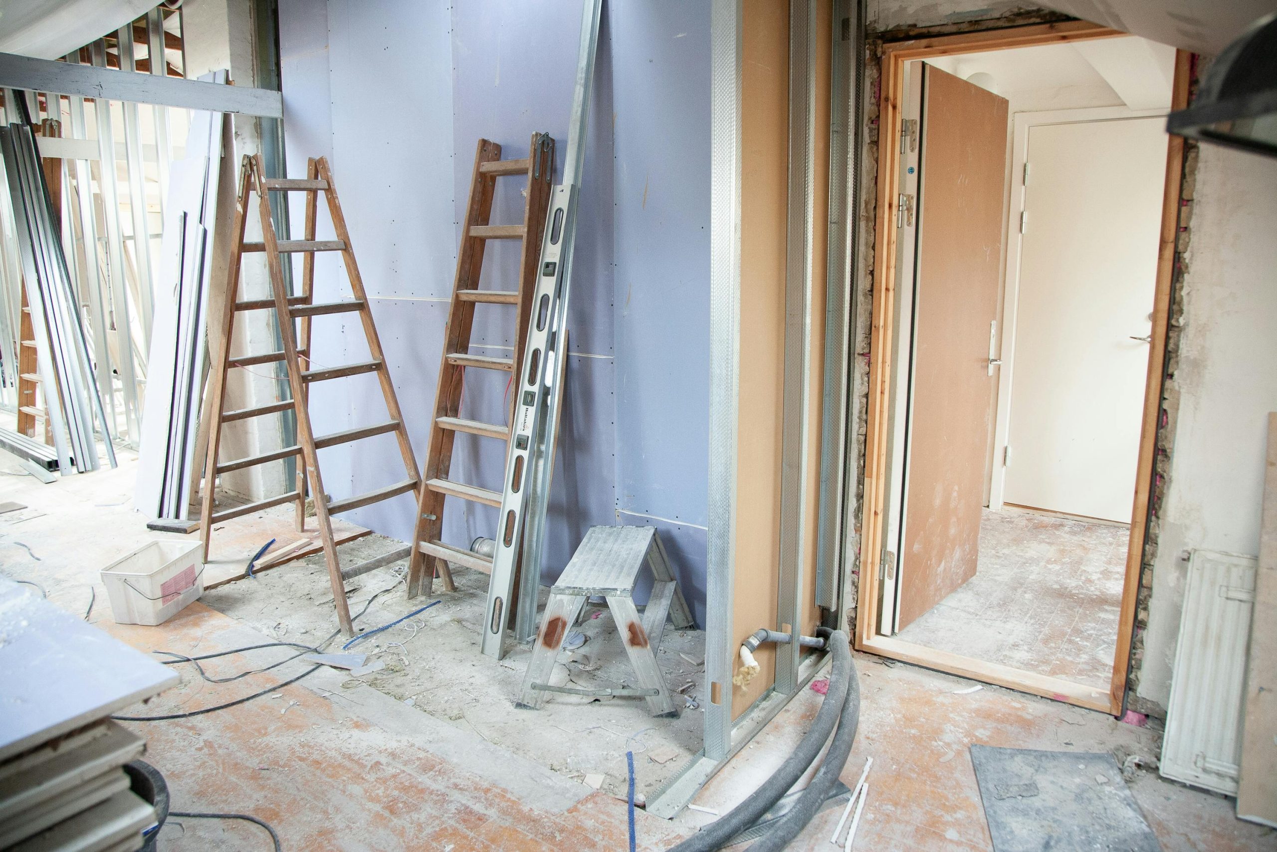Construction site featuring ladders and tools in a home renovation setting. Building Alterations Durban: Professional Structural Changes That Transform Your Property