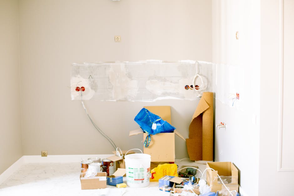 A room undergoing renovation with tools, supplies, wiring, and paint cans scattered around. Trusted electrical contractor Durban. From homes to offices, we provide certified electricians, compliance certificates & emergency electrical services.